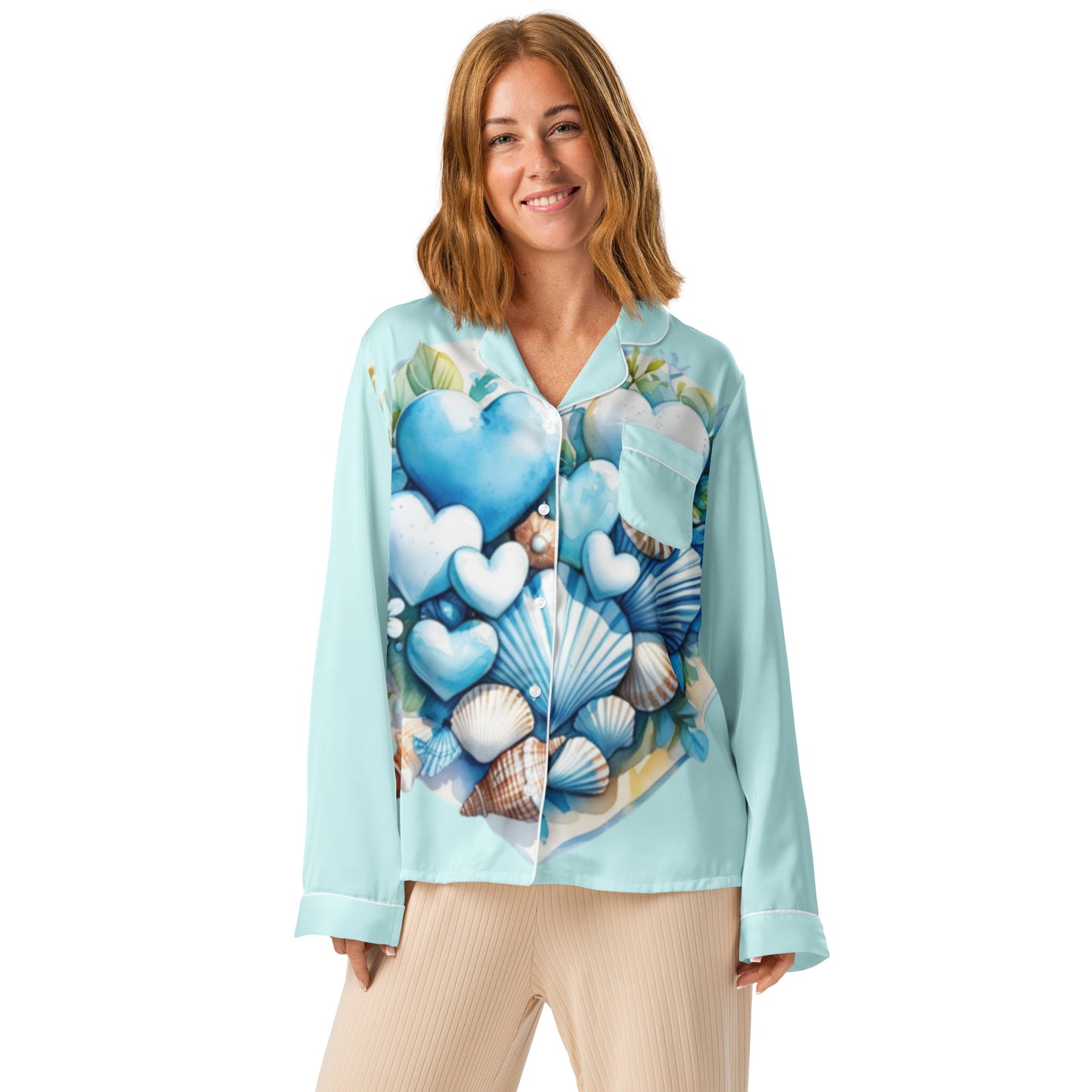 Woman in Coastal Hearts pajama top with blue hearts and shells design peaceful morning coastal lifestyle