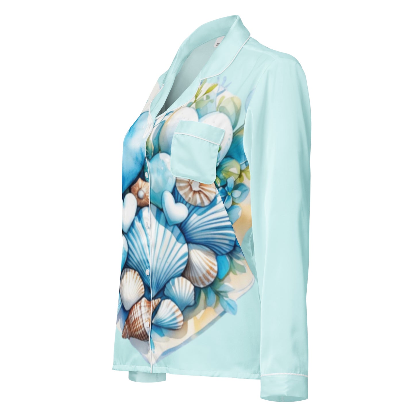 Woman in Coastal Hearts pajama top with blue hearts and shells design peaceful morning coastal lifestyle
