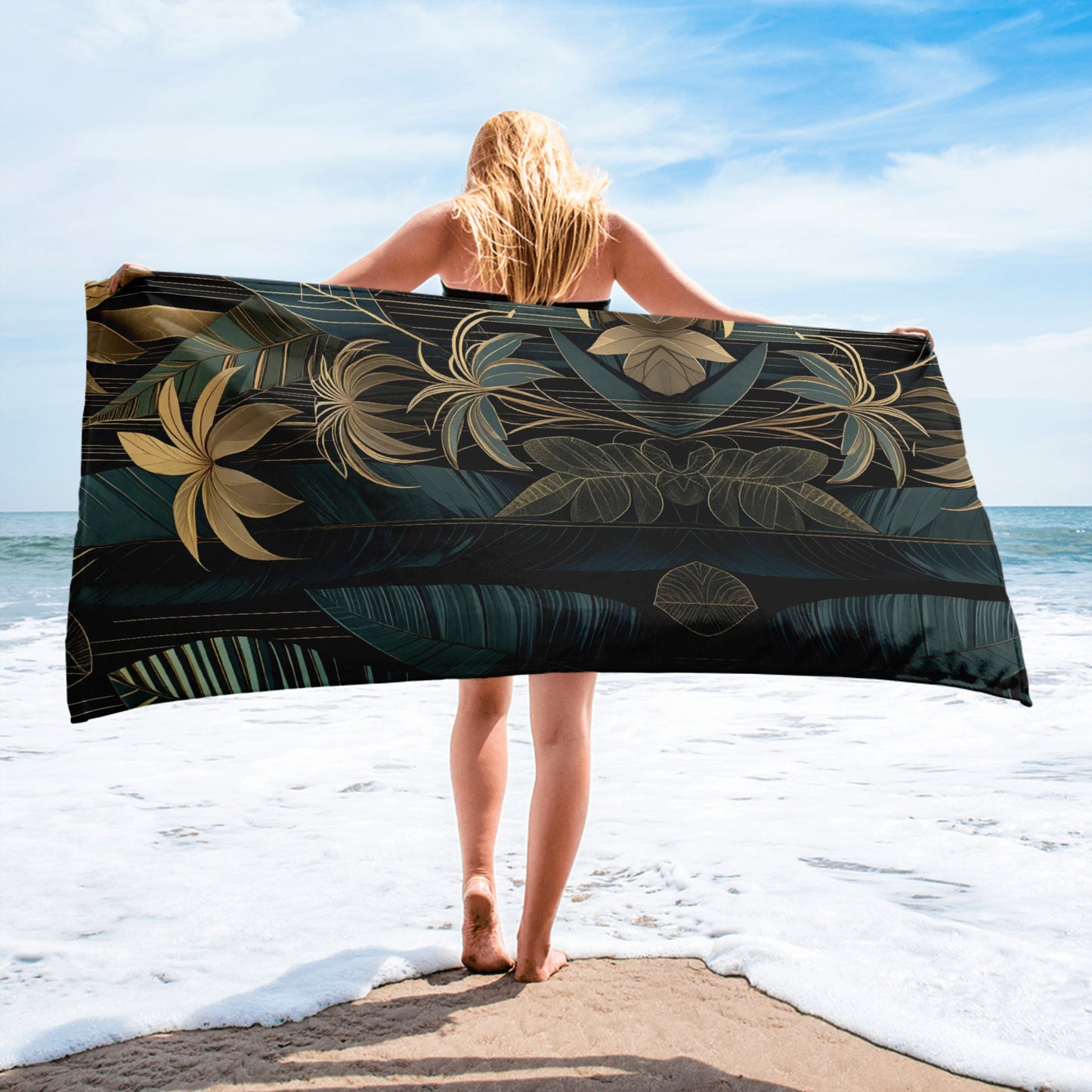 emerald and gold art deco beach towel on wooden deck in jungle setting