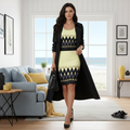 Elegant woman in yellow black geometric dress with trench coat in coastal interior