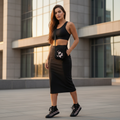 Fashionable woman in black athleisure with cherry blossom accessories