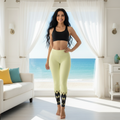 Kind beautiful woman with radiant smile in yellow yoga leggings in coastal interior