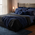 Luxurious cozy bedroom with Art Deco pillows in deep blue and black