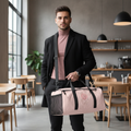 Stylish man in dusty rose turtleneck and black tailored trousers carrying botanical duffle bag