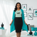 Stylish woman in mint panther t-shirt with black skirt and open turquoise cardigan