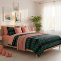 Sunny coastal bedroom with emerald mosaic comforter, white walls and curtains, abundant coral pink and peach decorative pillows, salmon pink throw, framed artwork in coral and emerald tones, green plants, coral pink candles and vases, warm sunlight