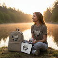 Woman in brown savanna Time by the River t-shirt with track pants, backpack, laptop sleeve and ceramic mug by peaceful river at sunrise